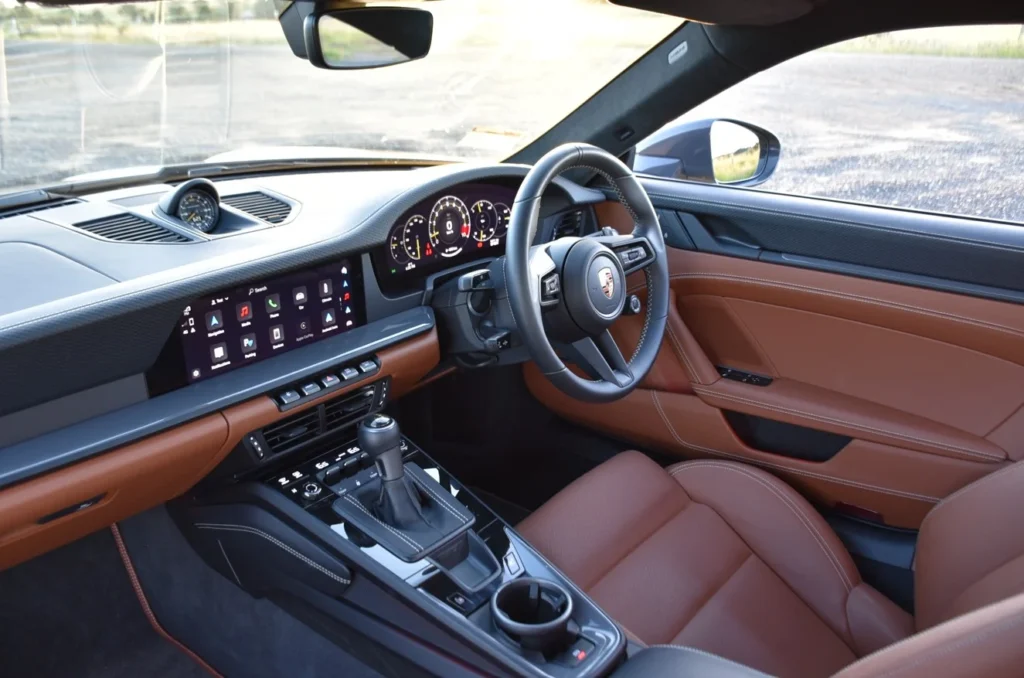 The 2026 Porsche 911 GT3 Touring ditches the wing but keeps the 9,000rpm soul, proving itself as a masterclass in naturally aspirated, high-performance engineering.