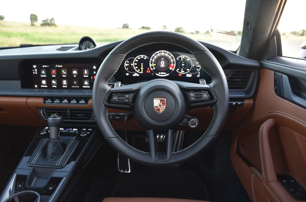 The 2026 Porsche 911 GT3 Touring ditches the wing but keeps the 9,000rpm soul, proving itself as a masterclass in naturally aspirated, high-performance engineering.