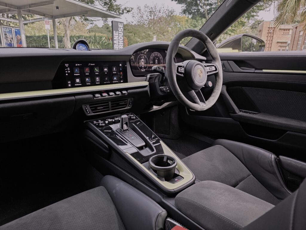 Our Porsche 911 Carrera 4 GTS T-Hybrid review finds hybrid assistance adds response and pace without losing the 911’s everyday appeal.