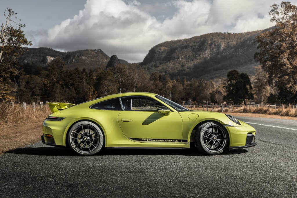 Our Porsche 911 Carrera 4 GTS T-Hybrid review finds hybrid assistance adds response and pace without losing the 911’s everyday appeal.
