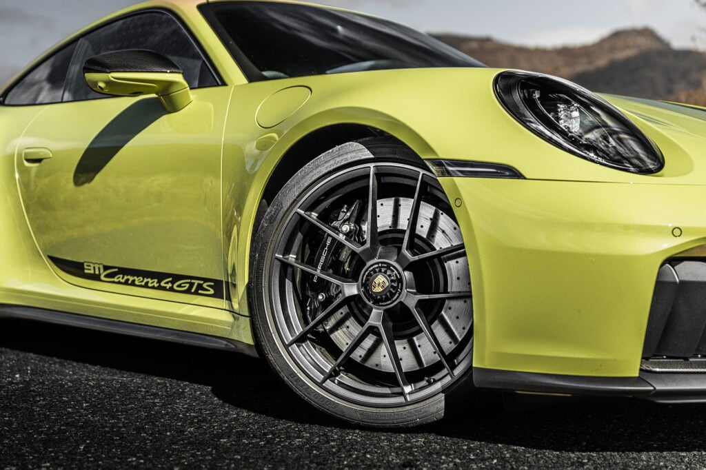 Our Porsche 911 Carrera 4 GTS T-Hybrid review finds hybrid assistance adds response and pace without losing the 911’s everyday appeal.